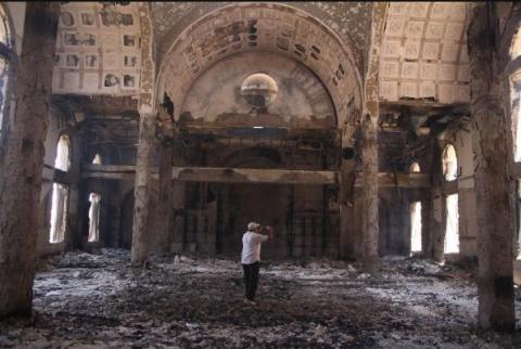 Copts celebrate mass inside burned historic church 